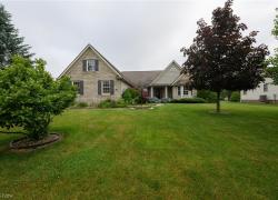 View of front of property featuring a front lawn